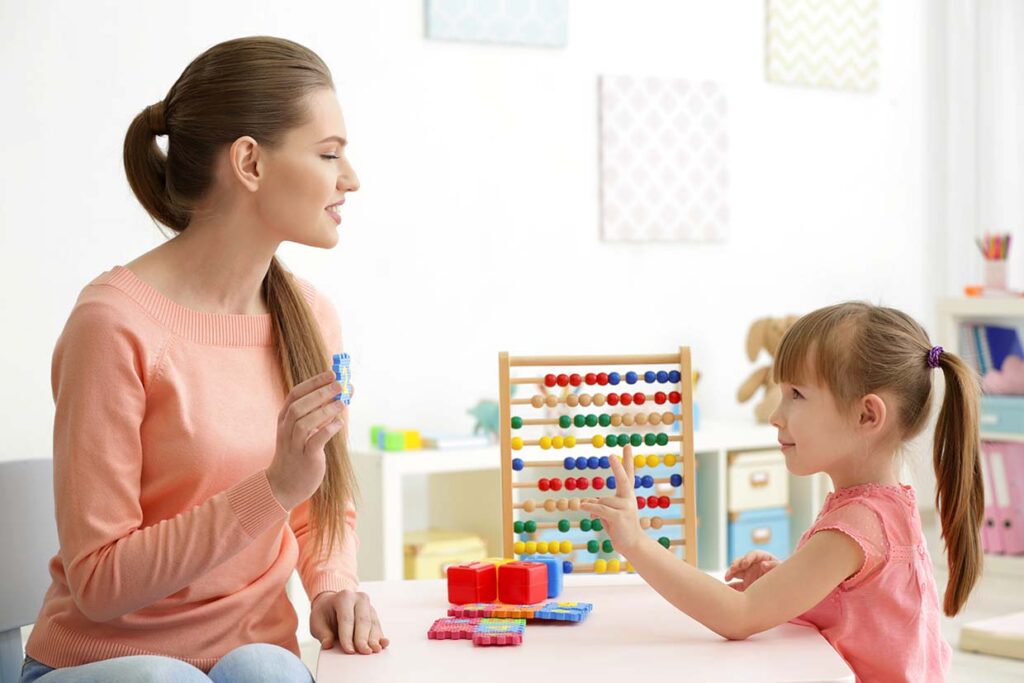 Little girl learning count with ABA tutor